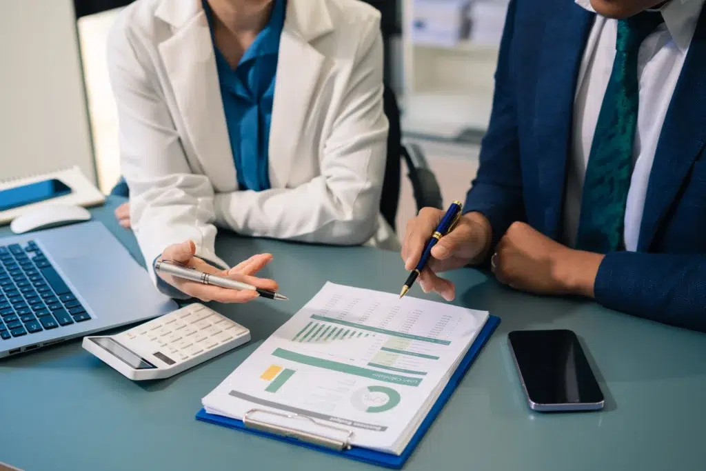 Healthcare team analyzing financial charts when selecting a healthcare RCM company partner