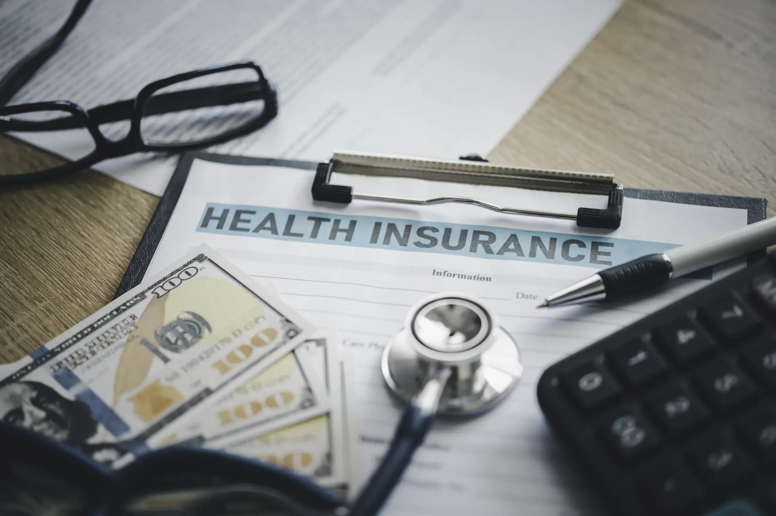 Health insurance document and stethoscope representing personal injury billing services process