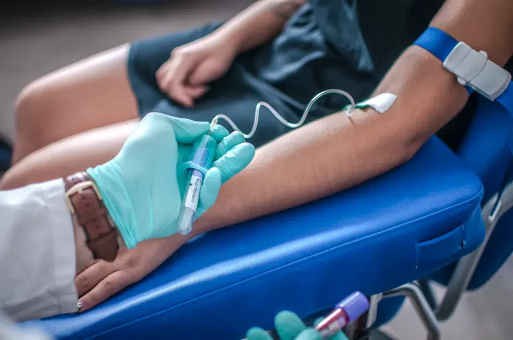 Healthcare professional accessing a patient's vein, the kind of administration documented for accurate infusion billing services