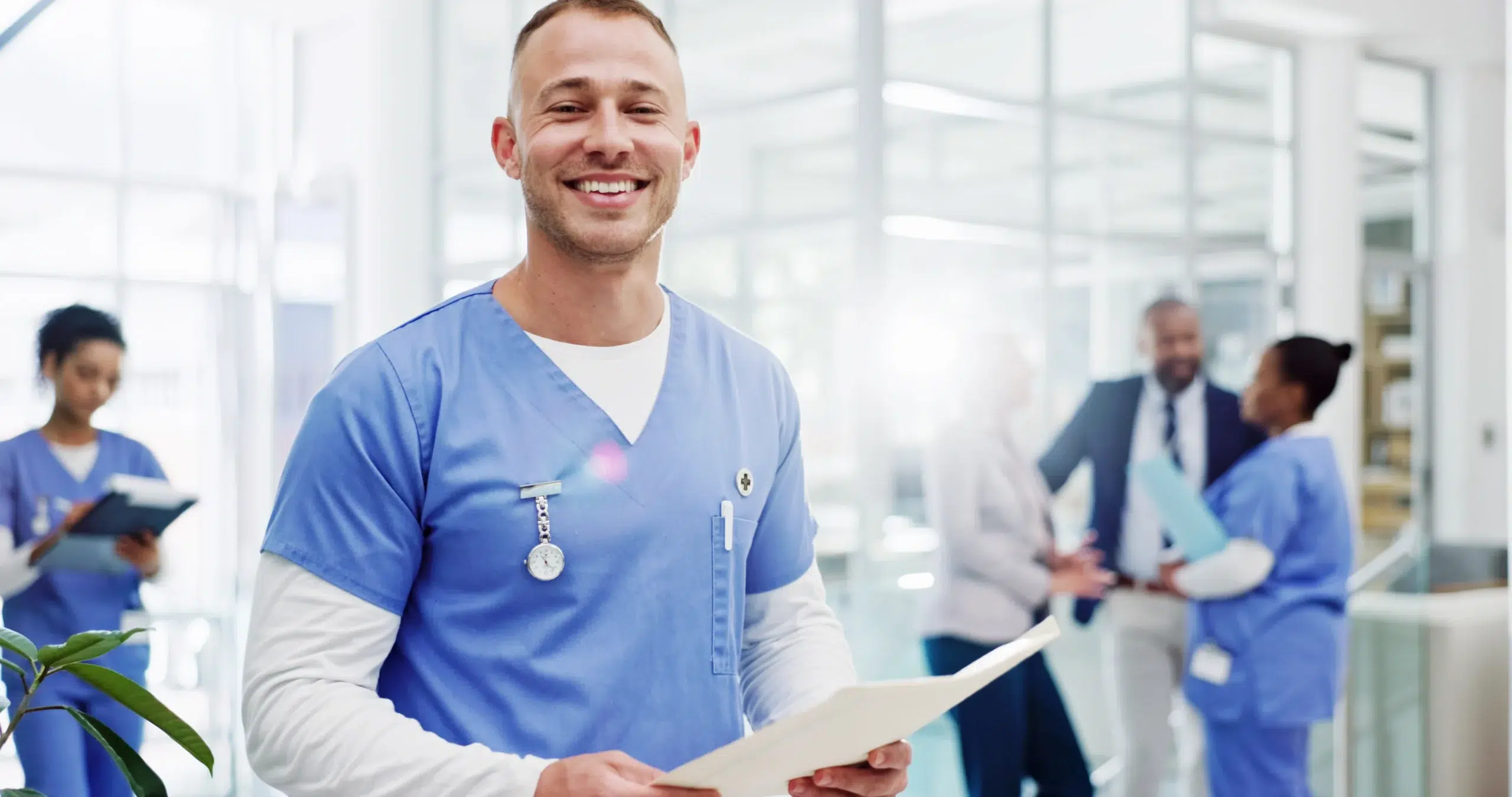 Smiling physician in a hospital, supported by revenue cycle management staffing that keeps coding, billing, and collections on track