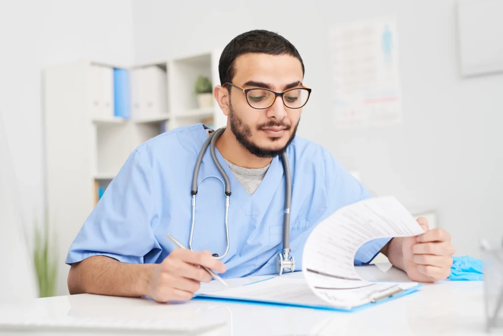 Doctor reviewing patient records, the documentation that supports CPT 96372 injection claims and their reimbursement